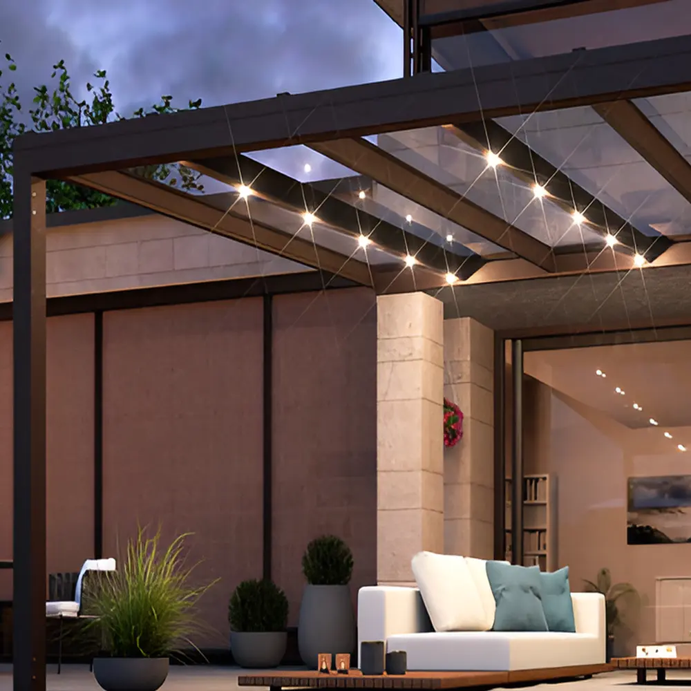 Glazen overkapping Nyon met sfeerverlichting boven een moderne zithoek