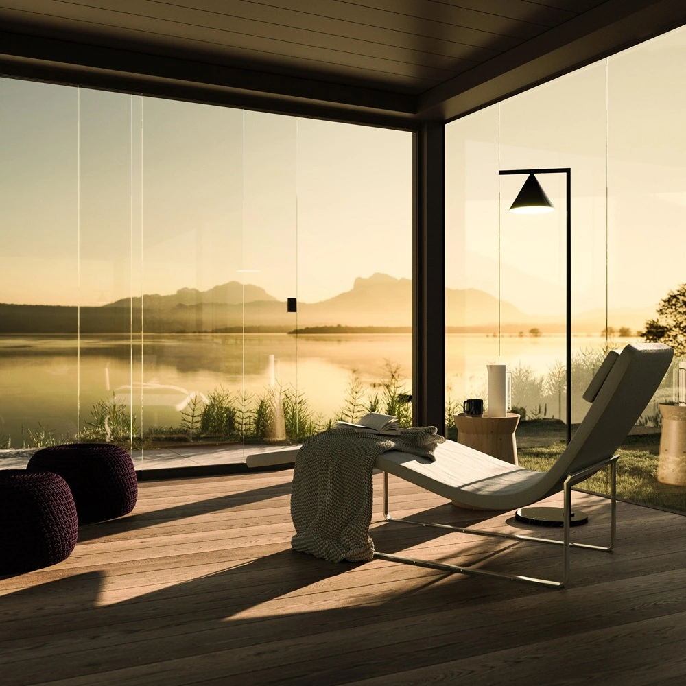 Lamellendak Brera met glazen wanden en uitzicht op een meer bij zonsopgang