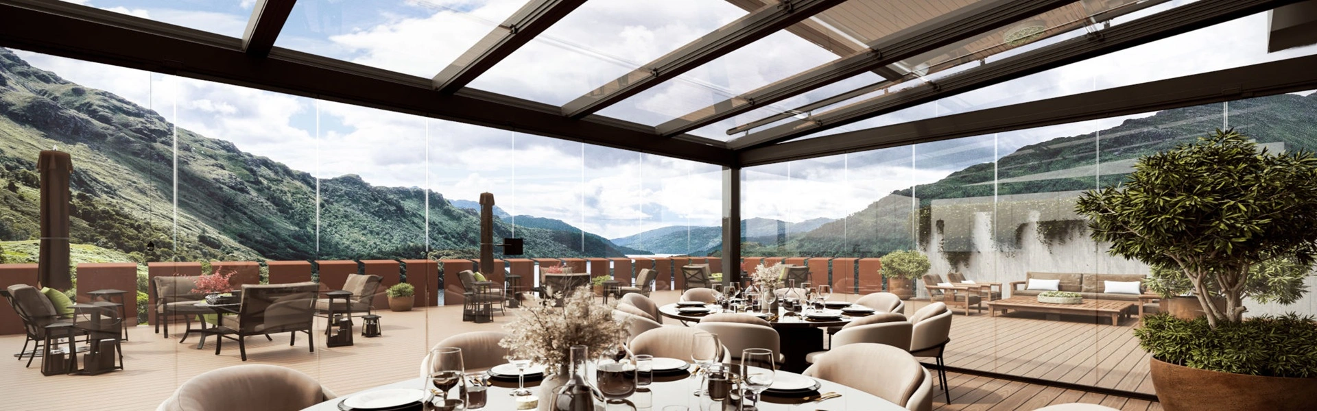 Glazen terrasoverkapping met uitzicht op bergen en terrasindeling