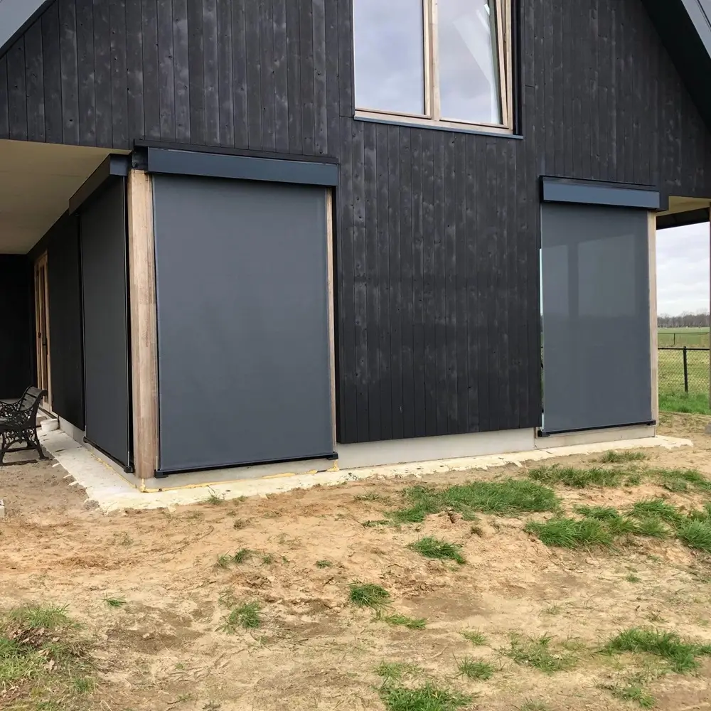 Woning in Dalfsen met dubbele kabelscreens van Veldman Zonwering